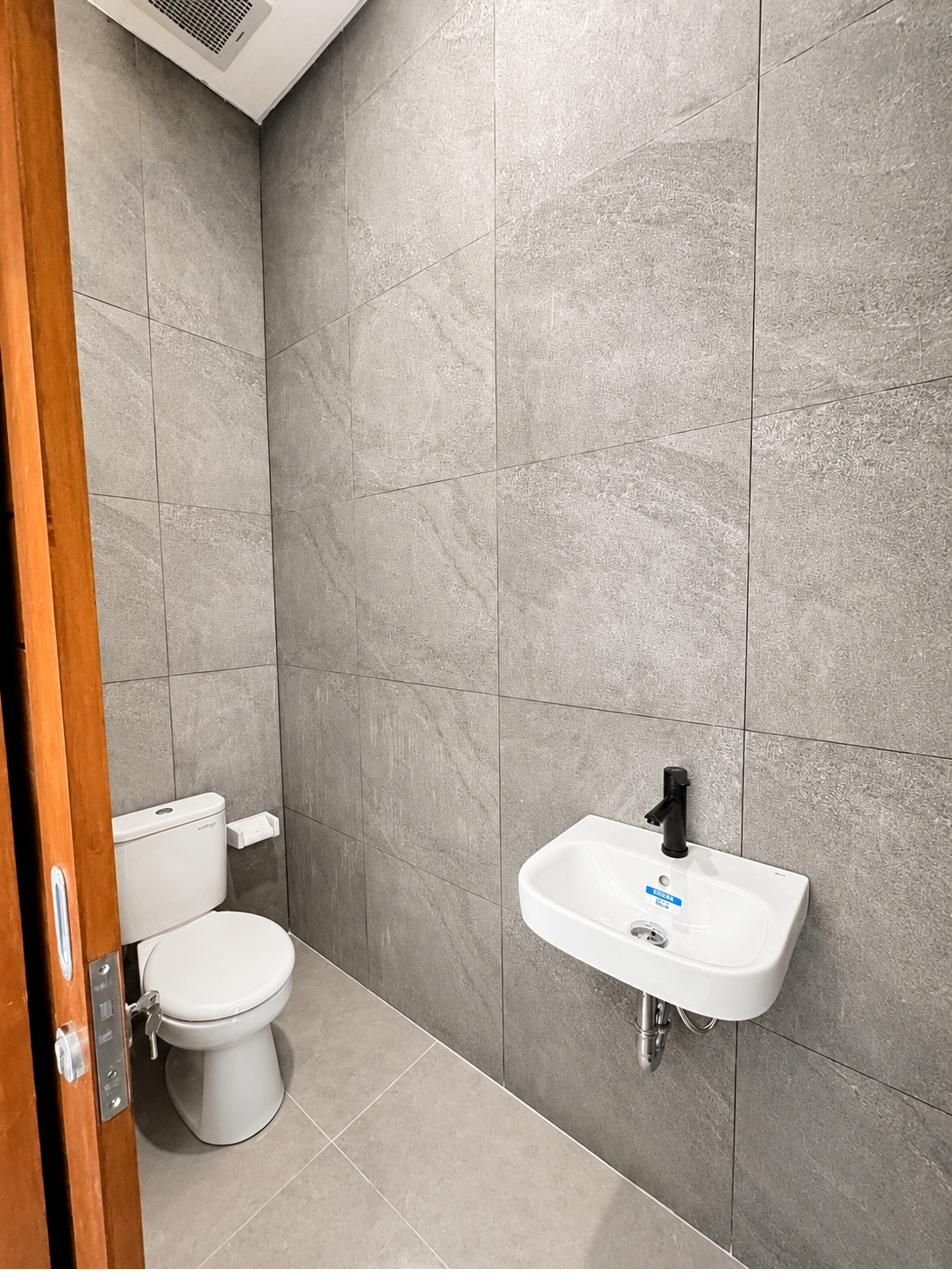 Guest powder room in grey stone